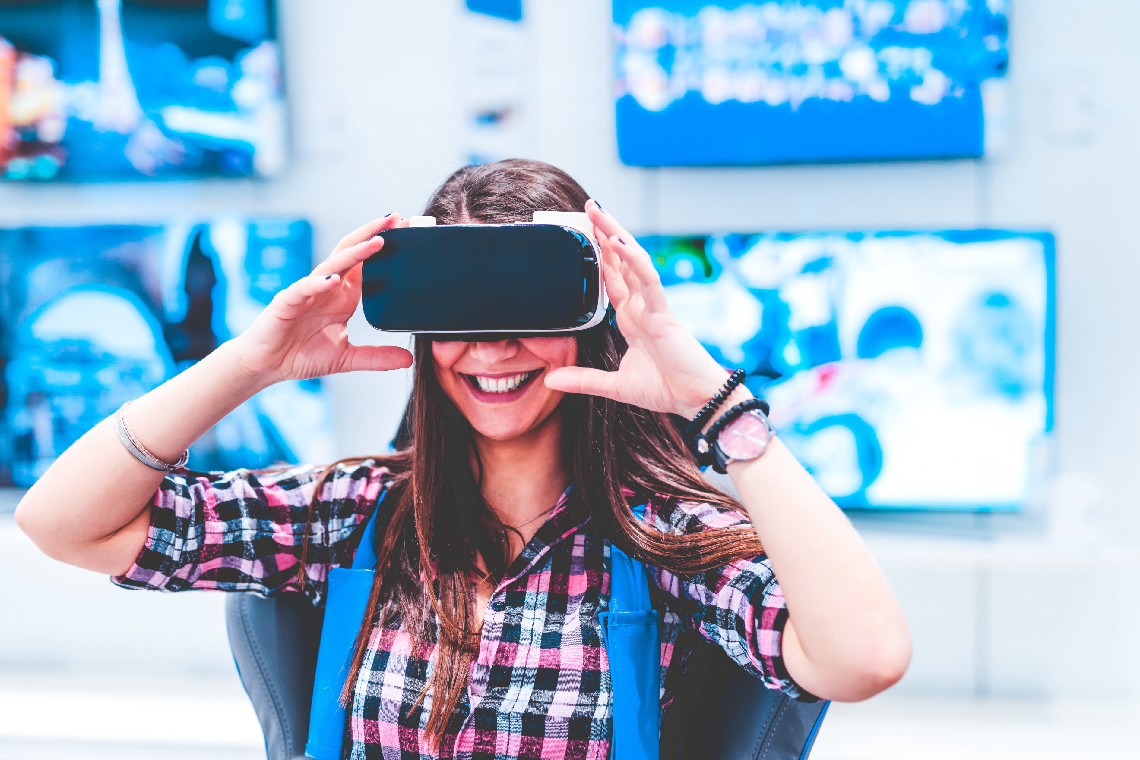 Walmart VR Traininng, Image of Walmart Employee using the Oculus VR Headset to Train