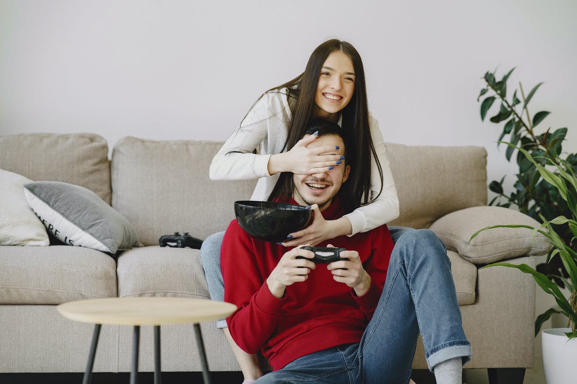 Couple playing video games indoors, thumbnail image for Chaos Theory's blog "How to Connect with your Customers During the 2020 Lockdown"