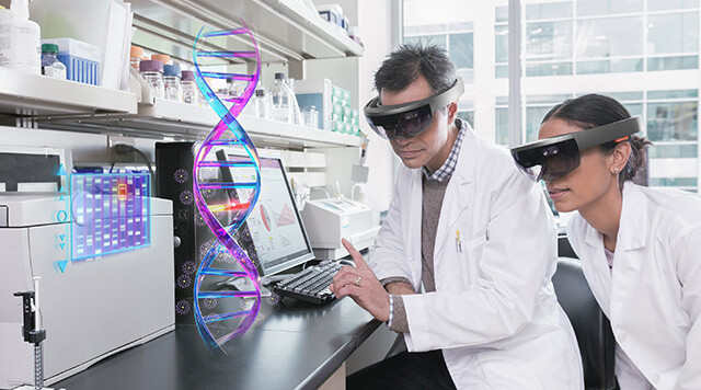 A photograph of scientists using augmented reality glasses for research and healthcare purposes - Chaos Theory | Serious Games Developer, Australia