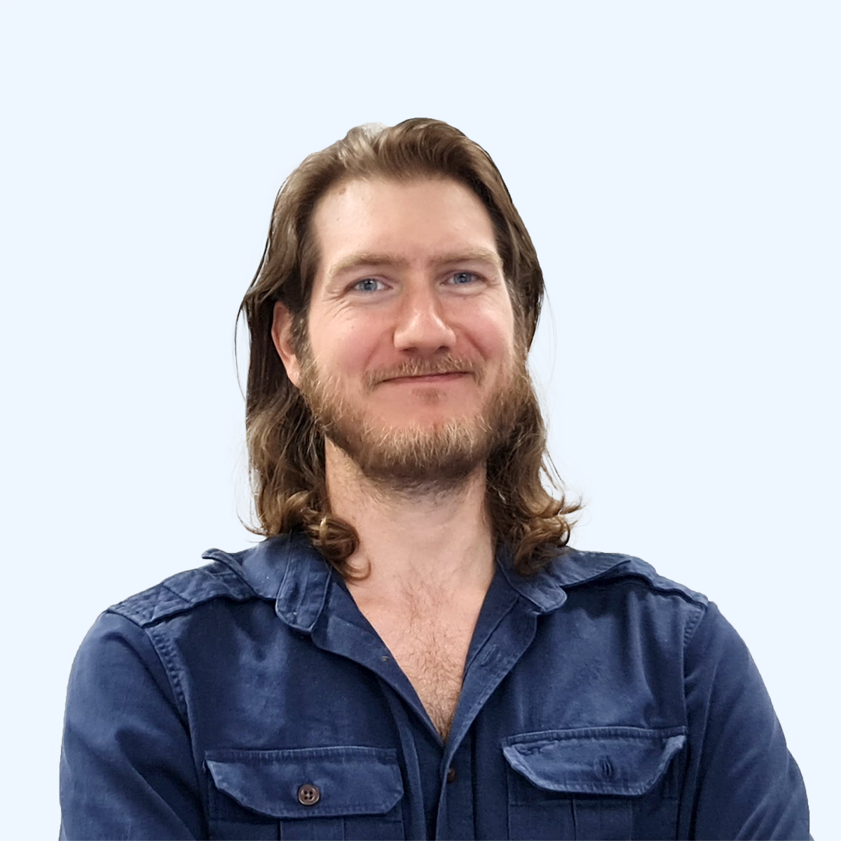 A headshot of an employee from Chaos Theory Games.