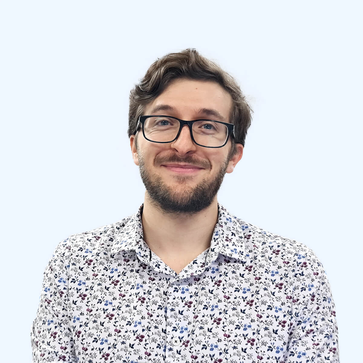 A headshot of an employee from Chaos Theory Games.