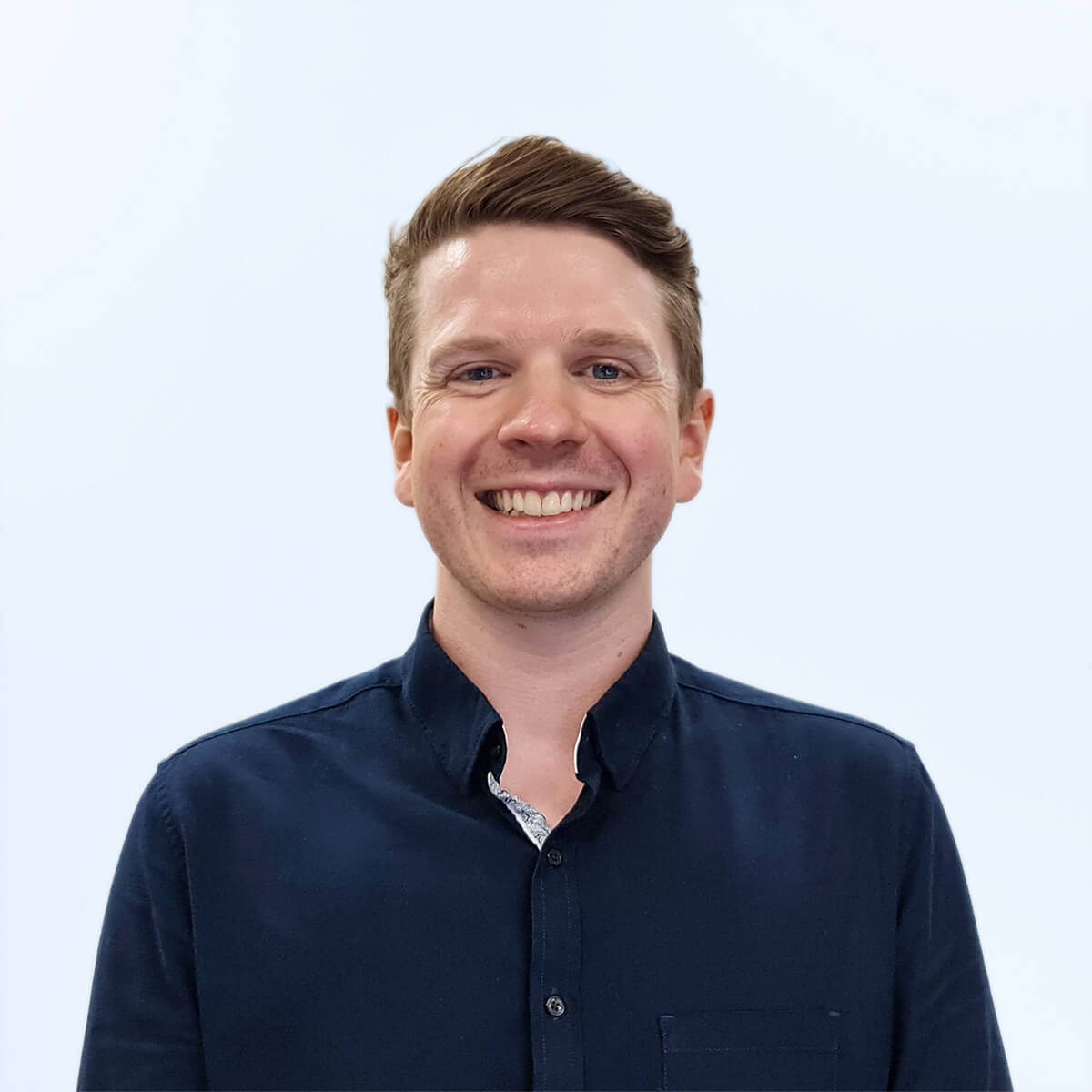 A headshot of an employee from Chaos Theory Games.