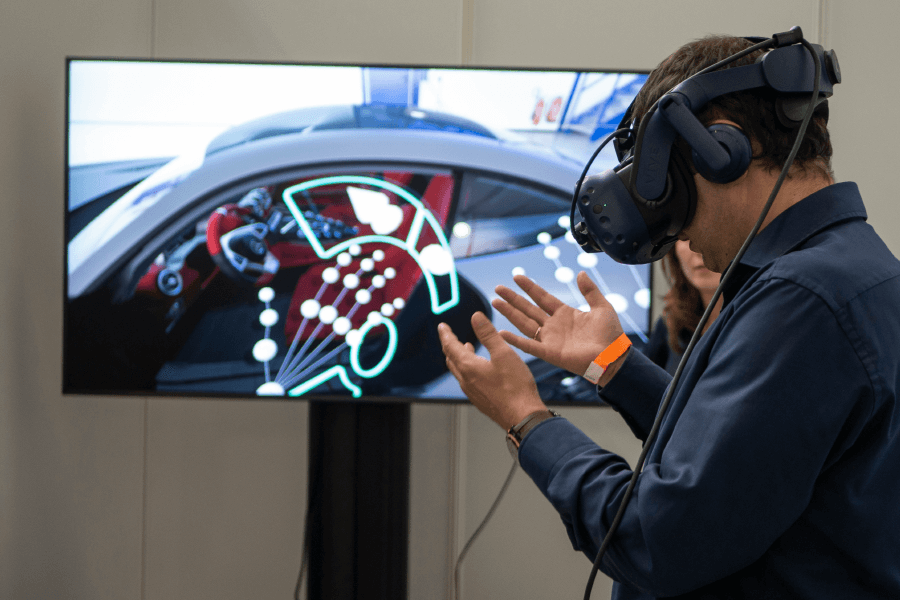 A man learning how to drive through Virtual Reality
